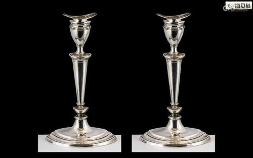 Pair of Silver Candlesticks in the Adams style, London 1906,...