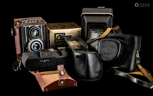 Five Assorted Vintage Cameras with accessories and booklets ...