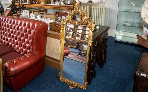 A Collection of Three Modern Decorative Gilt Mirrors, gilded...