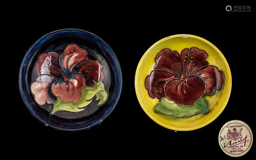 Two Moorcroft Dishes, one 5.5'' diameter in dark blue with p...