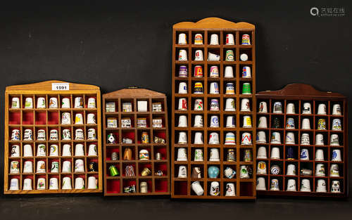 Collection of Thimbles displayed in four wooden cases, appro...