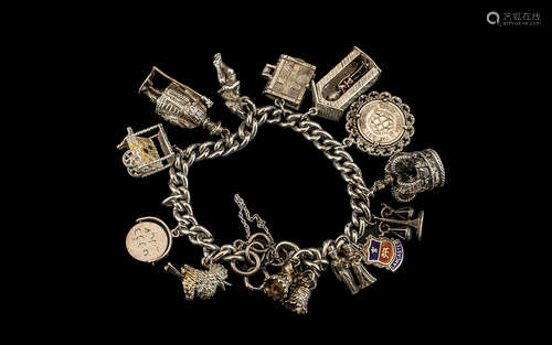 A Vintage Sterling Silver Charm Bracelet - Loaded with Excel...