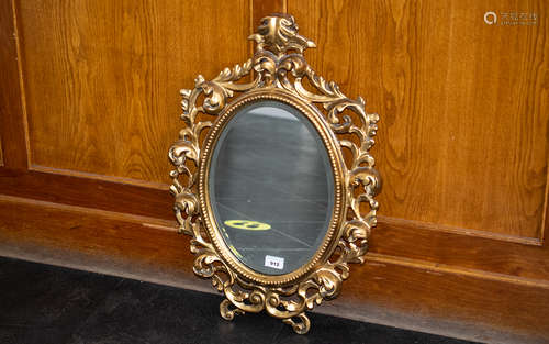 Fine Quality Florentine Carved Giltwood Mirror of oval shape...