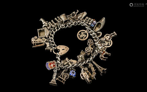 A Vintage Sterling Silver Charm Bracelet Loaded with 28 Silv...