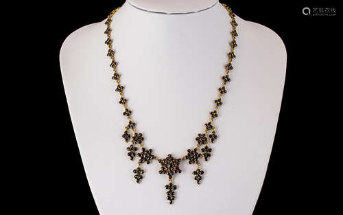 An Antique 19th Century Garnet Fringe Necklace, set in unmar...