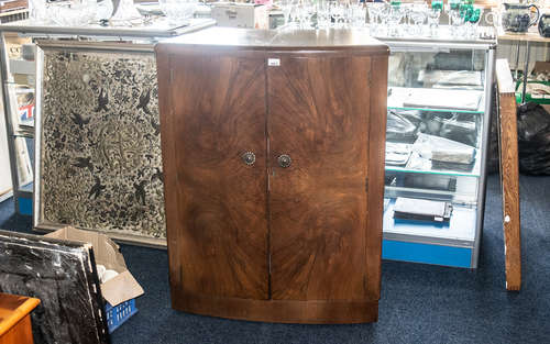 A Mid Century Bow Fronted Walnut Finish Cocktail Cabinet. Hi...