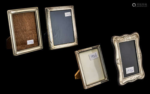 Four Photograph Frames comprising two small silver frames, 7...