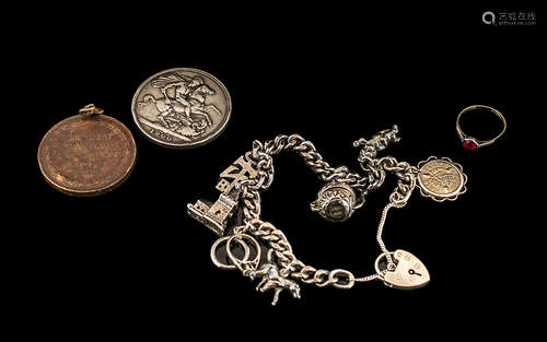 Silver Charm Bracelet with seven charms, a 1900 Victorian si...