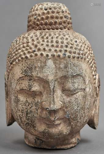 A South East Asian stone head of Buddha, 25cm h Some chips a...