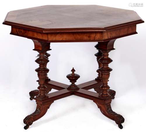 A walnut centre table, late 19th c, the butterfly veneered o...