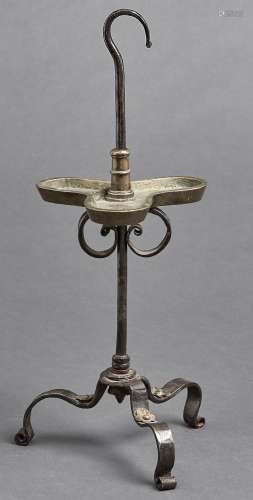 A brass and wrought iron adjustable oil lamp or porte chalei...
