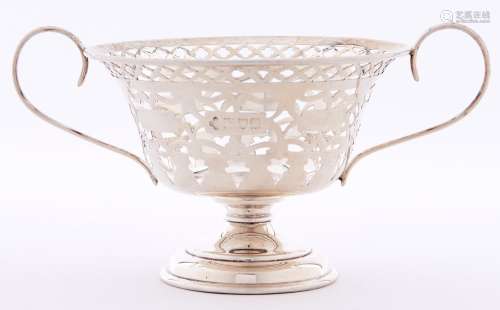 A Victorian two handled pierced silver bonbon dish of vase s...