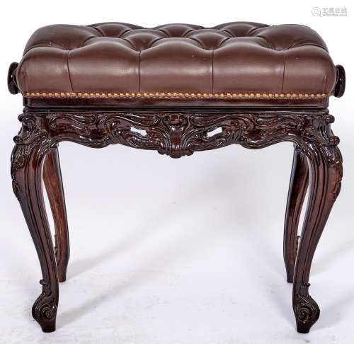 A George III style carved wood piano stool, covered in brown...