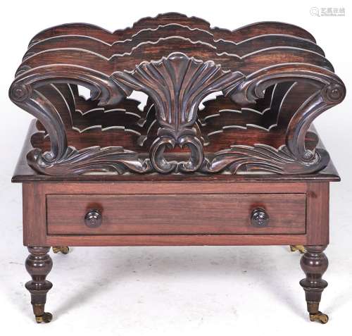 A Victorian carved rosewood canterbury, on turned legs and b...