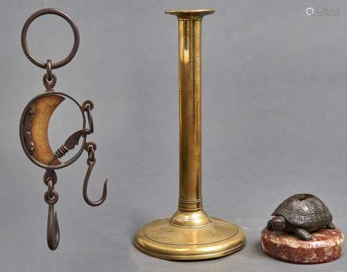 A late 17th c brass ejector candlestick, with circular drip ...