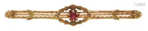 A bar brooch, paste set, in gold marked 10k, 3.1g