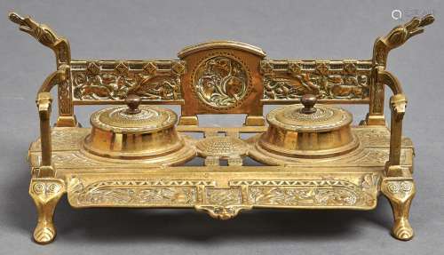 A brass inkwell of Celtic design, late 19th/early 20th c, th...
