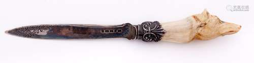 A Victorian silver letter knife, the bone handle carved as t...