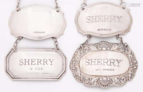 Two and a pair of Elizabeth II silver wine labels - sherry a...