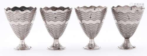 A set of four Ottoman silver zarfs, late 19th c, on flared f...