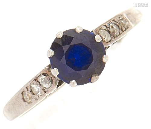 A sapphire and diamond ring, in white gold marked 18ct plat,...
