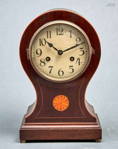 An Edwardian inlaid mahogany balloon shaped mantel clock, th...