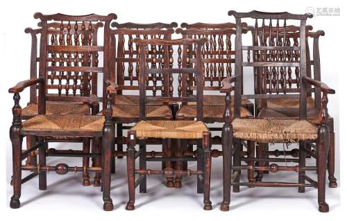 A set of eleven early Victorian rush seated ash spindle back...