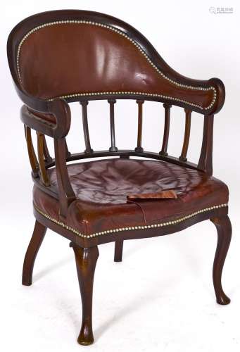 A Victorian mahogany armchair, covered in brown nailed back ...