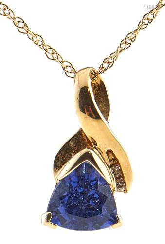 A tanzanite and diamond pendant, in gold marked 14k and gold...