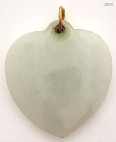 A celadon jade heart shaped pendant, gold loop, 6.5g