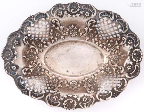 A Victorian die stamped silver bonbon dish, shaped oval with...