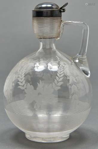 A Victorian silver mounted threaded glass claret jug, of glo...