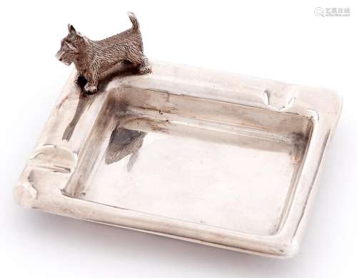 A George VI silver ashtray, the rim set with terrier, 80mm l...