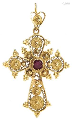 A gold filigree cross set with a synthetic ruby, marked 18k,...
