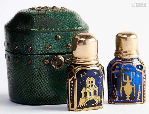 A pair of English gold capped blue glass scent bottles and s...
