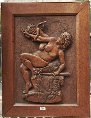 A carved oak bas relief panel, first half 20th c, of a bacch...