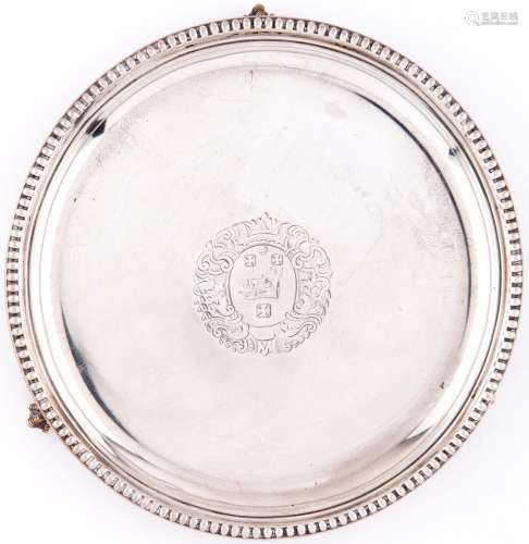 A Victorian silver waiter, with plain cavetto and beaded rim...