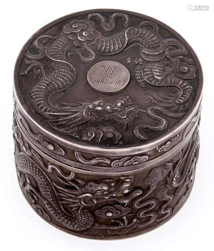 A Chinese round silver repousse dragons box and cover, c1908...