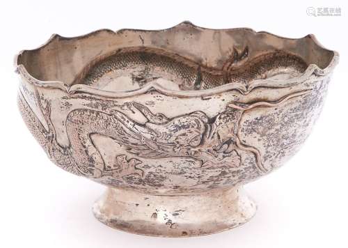 A Chinese silver repousse dragon bowl, early 20th c, the dra...
