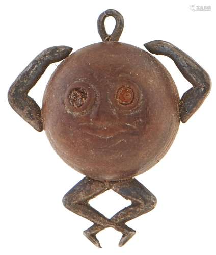 A WWI wood and metal Fumsup Touch Wood charm