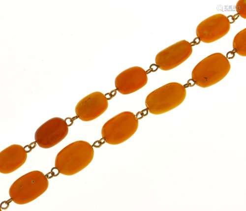 A necklace of 64 amber beads, 61.7g Evident from image