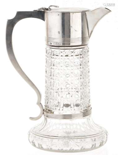 A Victorian silver mounted cut glass claret jug, hob nail cu...
