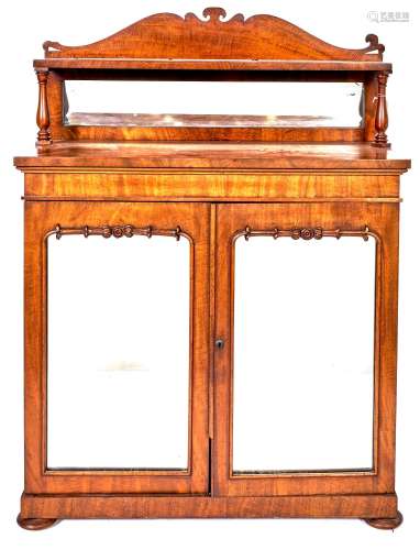 A Victorian mahogany chiffonier, the lower part enclosed by ...