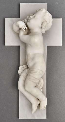 An Italian alabaster carving of a cherub and crucifix, the r...