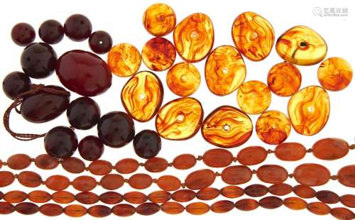 Two necklaces of amber beads, miscellaneous irregular shaped...