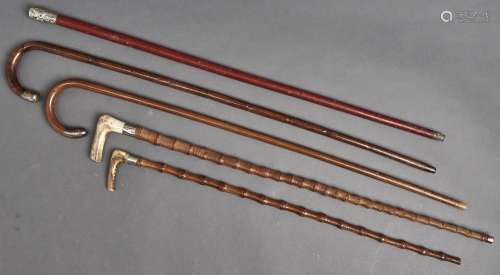 Five silver mounted and other walking canes and sticks, all ...