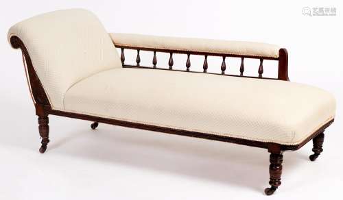 A late Victorian carved mahogany chaise longue, on turned le...