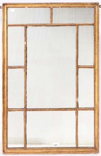 A George III giltwood and composition mirror, the beaded rec...