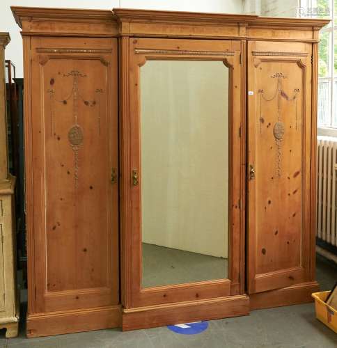 An Edwardian breakfront stripped pine wardrobe, with neo cla...