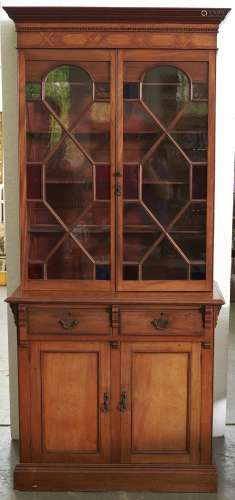 An oak, walnut, mahogany, plane wood and parquetry bookcase,...